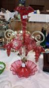Victorian cranberry and clear epergne having central flute with crimped everted rim, two similar