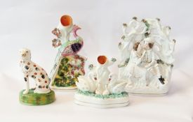 Small collection of Staffordshire figurines to include swan spill vase, peacock vase, seated