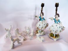 Six Dresden porcelain cherub figures, and pair continental electric table lamps in the form of