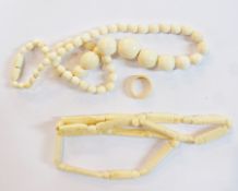 String of graduated ivory beads, an ivory ring and a string of ivory beads (3)