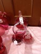 Four various cranberry and clear glass baskets