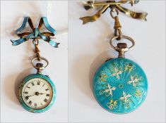 A lady's blue enamel and white metal fob watch with silver and gilt foliate scrollwork decoration,