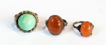 Two silver and stone rings, another costume ring and a silver-coloured propelling pencil