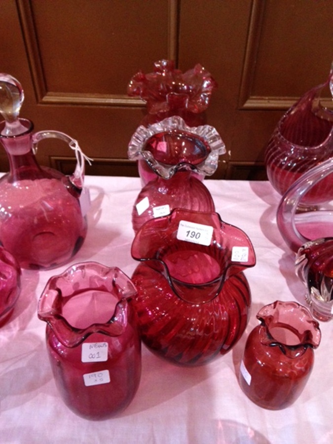Five various cranberry and clear vases with frilled everted rims