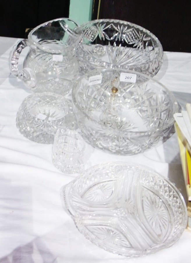 Two cut glass fruit bowls, circular serving dish, water jug, cream jug, ashtray and a scent