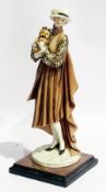 Resin figure of 1920's lady holding dog