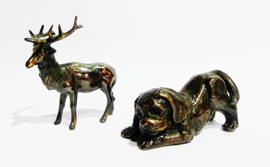 Bronze figure of a playful puppy and a bronzed metal figure of a reindeer (2)