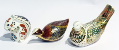 Three Royal Crown Derby paperweights, a dove, a game bird and a squirrel