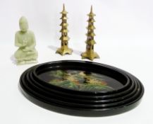 A Chinese carved celadon figure of a Buddha, 17cms, a pair of Oriental brass pagodas, height 20cms