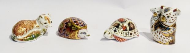 Four Royal Crown Derby paperweights viz:- "Australian Collection Koala Bear and Baby", "Orchard