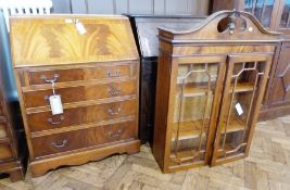 Reproduction figured wood bureau bookcase, the top with swan-neck pediment fitted two shelves