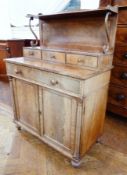 19th century mahogany chiffonier, the raised back with shelf on scroll supports to three frieze