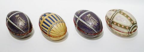 A collection of tinplate eggs, all decorated and opening (13 altogether) (1 box)