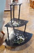 Victorian black lacquered whatnot, three tier painted with daisies, 80cm high approx.