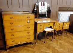 Mid 20th century figured walnut part bedroom suite, viz:- chest of five long drawers, kneehole