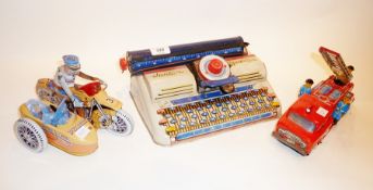 Tinplate Junior typewriter and a tinplate motor Harley Davidson policeman and a tinplate Chinese