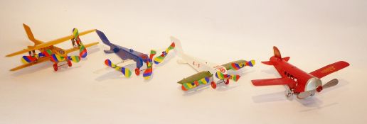 Three tinplate aeroplanes and two other tinplate clockwork wind-up aeroplanes (5) (1 box)