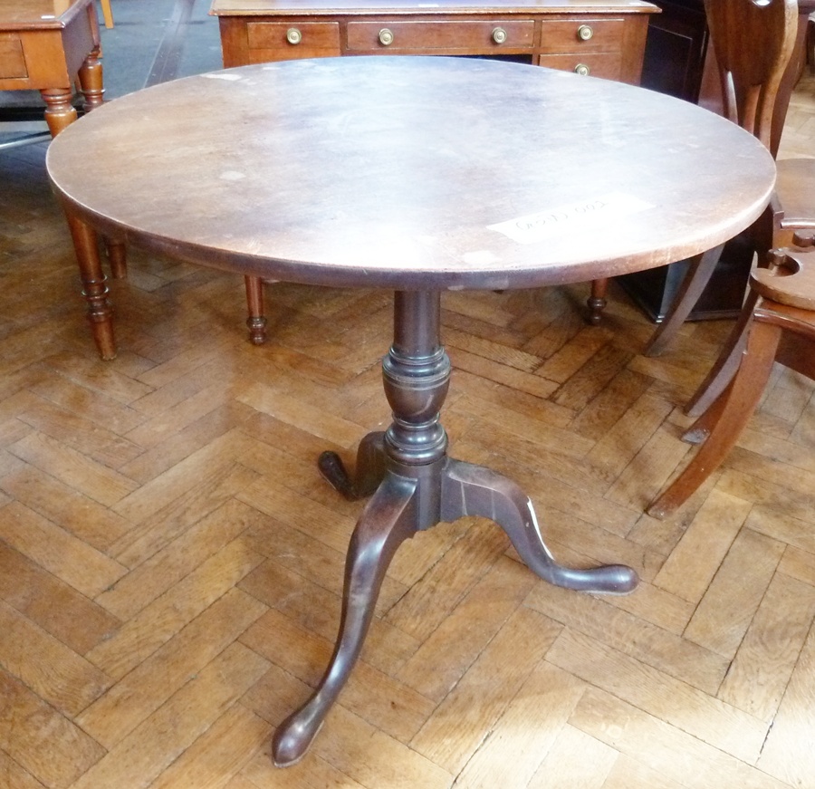 Georgian oak tilt-top occasional table, circular on turned column three scroll supports, pointed pad