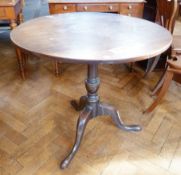 Georgian oak tilt-top occasional table, circular on turned column three scroll supports, pointed pad