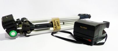 A Polaroid auto focus 660 camera, together with a Slik 35D tripod