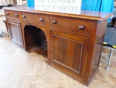 Large oak sideboard having stepped and quadrant mould edge, three frieze drawers with turned bun