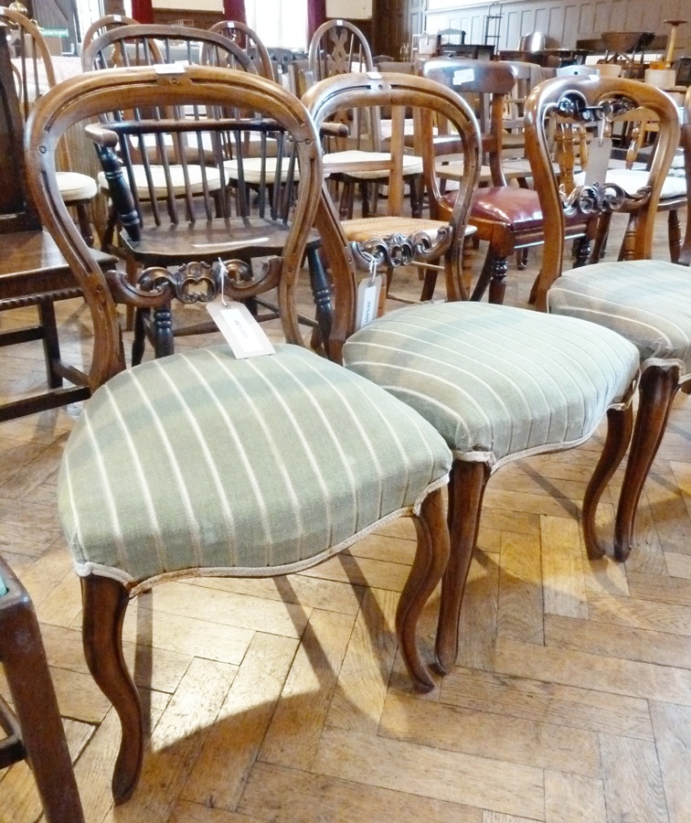 Set of four plus two Victorian walnut dining chairs, each hoop-back, all with pierced foliate scroll