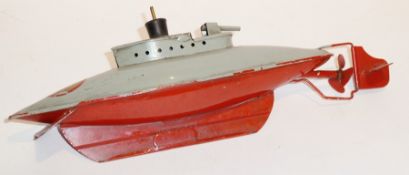 Early Sutcliffe tinplate clockwork "Unda-Wunda" submarine with red hull, grey superstructure,