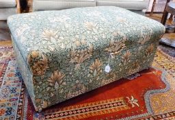 Box ottoman, upholstered in green foliate William Morris style fabric, with brass drop handle and