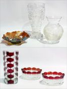 A cut glass vase, a pair of red flash glass dishes with a similar cylindrical vase and a moulded