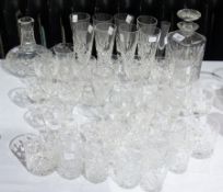 A quantity of glassware to include decanter, a carafe, eight champagne flutes, brandy balloons,