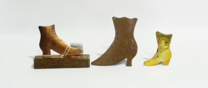 Small collection of copper cut outs of 18th century lady's boots, a pair raised on oak plinth bases,