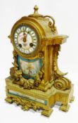 French empire style mantel clock within foliate gilt metal case, decorative porcelain dial with