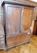 19th century mahogany linen press, the top section with hanging rail enclosed by pair framed