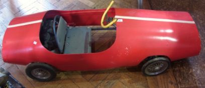 Vintage wooden child's pedal red racing car, 149cm long