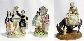 Two Staffordshire flatback figure groups and a lady riding a donkey (3)