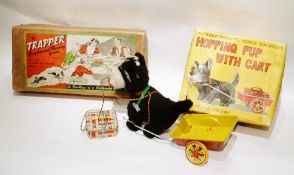 "The Trapper", greyhound tinplate racing game, wind-up, boxed and Japanese tinplate "Hopping Pup