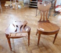 Pair of Victorian mahogany hall chairs with pierced waisted back, curved and C-scroll top rail,