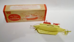 Late 1960's Sutcliffe tinplate clockwork Sea World Atomic Submarine, with key, propeller and rudder,