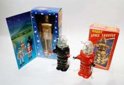 Three Chinese "Robot Space Troopers", 17cm high, boxed, another in pieces and a Chinese gold man