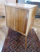 Mid 20th century walnut television cabinet having pair tambour turned on turned splayed supports