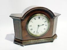 Early 20th century mahogany cased mantel clock with enamel dial and French movement on bun feet,