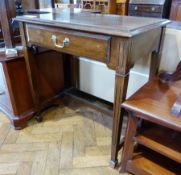 Stained wood side table having single drawer with brass drop handle on fluted tapering supports,