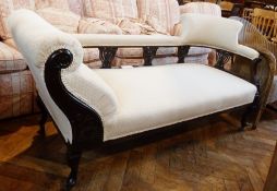 Late Victorian/Edwardian chaise longue having scroll end, padded top rail back supported on