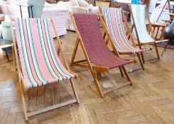 Four vintage folding deck chairs with striped and tartan fabrics