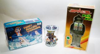 Chinese tinplate robot "Space Walkman" and Chinese tinplate Schylling rocket carousel and
