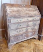 Georgian mahogany bureau, the fitted interior with central door, pigeonholes and small drawers, four