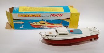 1970's Sutcliffe tinplate clockwork Commodore cruiser with white deck, blue hatch cover, red hull,