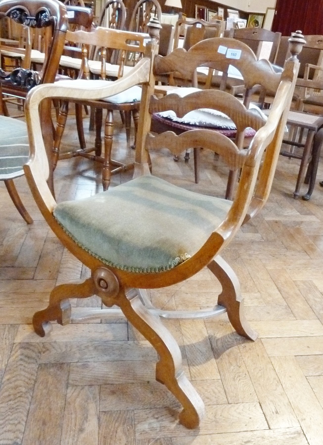 Late 19th/early 20th century open-arm 'X' frame chair having triple arch and scroll crossrail back