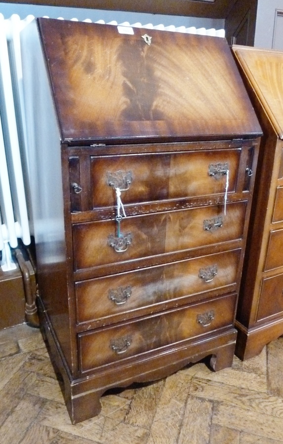 Reproduction lady's mahogany bureau having four drawers on bracket feet, 52cm wide