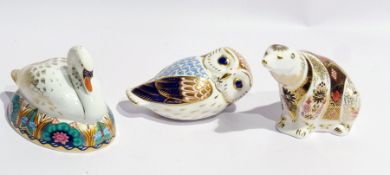 Three Royal Crown Derby paperweights viz:- "Swan on Ornate Nest", an owl and a polar bear